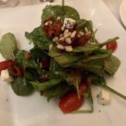 Baby Kale Salad · Baby kale with pears, pomegranate, candy walnut and goat cheese in a raspberry vinaigrette d...