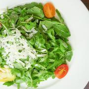 Rucola Salad · Baby arugula, cherry tomatoes topped with extra virgin olive oil.
