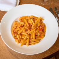 Penne alla Vodka Pasta · Penne with pancetta and peas in a vodka rose cream sauce.