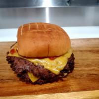 smashUP Cheeseburger · 2 thinly smashed Angus ground beef seared on the grill on a toasted potato bun with yellow A...