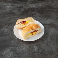 Fried Egg with Bacon Sandwich · Pan cooked eggs.