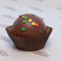 Birthday Cake Truffle · Milk chocolate shell filled with white chocolate cake batter and topped with sprinkles