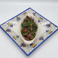 Lamb Tibs with Spinach · Tender cubed lamb marinated with our own signature sauce toasted with spinach, red onions, t...