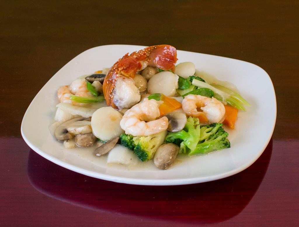 10. Seafood Delight · Jumbo shrimp, sea scallops and lobster meat sauteed with mixed vegetables in a white sauce.