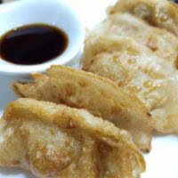 Chinese Ravioli (5) · Steamed or fried. Seasoned shrimp and Asian style pork dumpling. Served with sweet ginger sa...