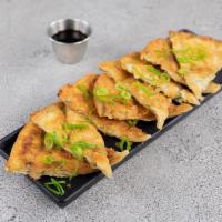 Scallion Pancake · Asian style crunch pancaked. Seasoned scallion dough fried till golden brown. Served with sw...