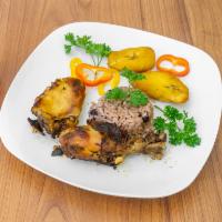 Jerk Chicken · Served With your Choice Of Rice and Peas or white rice and 1 side of your Choice.
