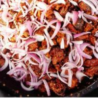 Asun · Asun (spicy roast goat) – spicy roasted goat chopped into bite-sized pieces, with big bold a...