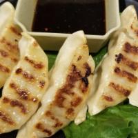 Gyoza (5 Pcs) · Japanese style pot stickers pork and vegetable or vegetable only.