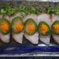 Hamachi Carpaccio  · Ten pieces of yellowfin tuna sashimi with seaweed salad, jalapenos, masago and ponzu sauce