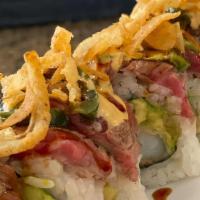 Surf & Turf · Shrimp tempura and avocado topped with seared beef tataki , crunchy kara-age fried onion, po...