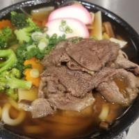Niku Udon · Beef, vegetables, and noodles served in a light broth.