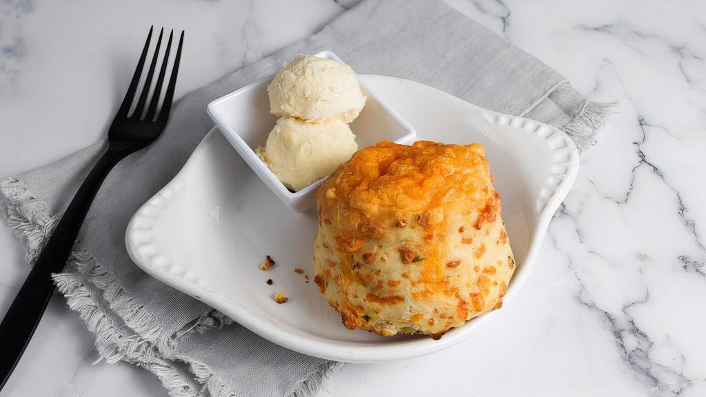 Cheddar Jalapeno Biscuit (V) by Homeroom · By Homeroom. A fluffy biscuit with hint of spice and covered in cheese, served with whipped honey butter. Contains gluten, dairy, nightshades, and eggs. We cannot make substitutions.