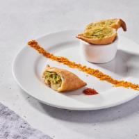 Classic Northern Samosas (VG) by dosa by DOSA · By dosa by DOSA. 2 pieces. Savory Indian pastries made with spiced potatoes, green peas, gin...