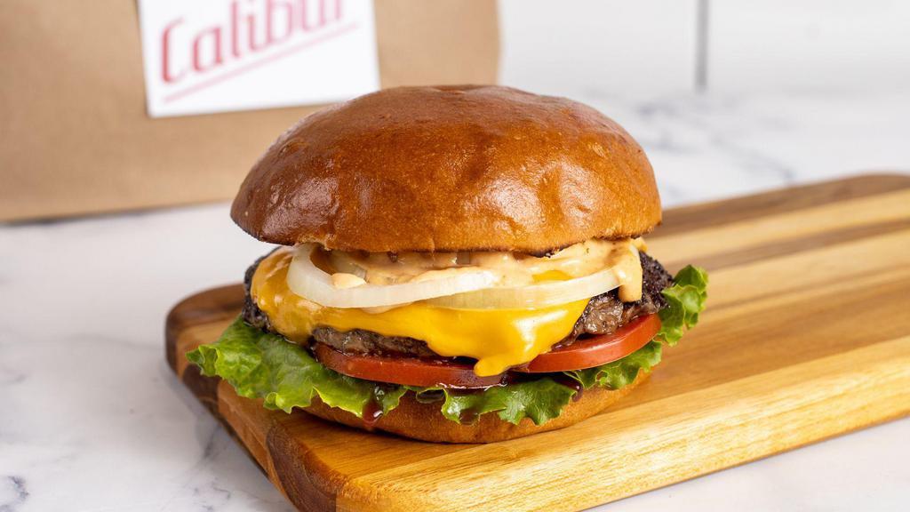 Single Cheeseburger by Calibur Express · By Calibur Express. 1/4 lb fresh, organic, grass fed California beef with American cheese. Served with lettuce, tomato, yellow onion, and Calibur sauce on the side. Contains gluten, dairy, soy, nightshades, and eggs. We cannot make substitutions.
