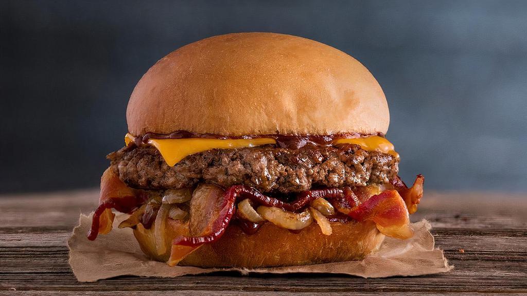 Cheddar Bacon Burger · Quarter pound of fresh, never-frozen Certified Angus Beef®, Tillamook® Cheddar Cheese, Applewood Smoked Bacon, Grilled Onions, BBQ Sauce, Potato Bun