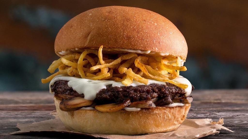 Mushroom Swiss Burger · Quarter pound of fresh, never-frozen Certified Angus Beef®, Swiss Cheese, Sautéed Mushrooms, Fried Onion Strings, Mayo, Potato Bun