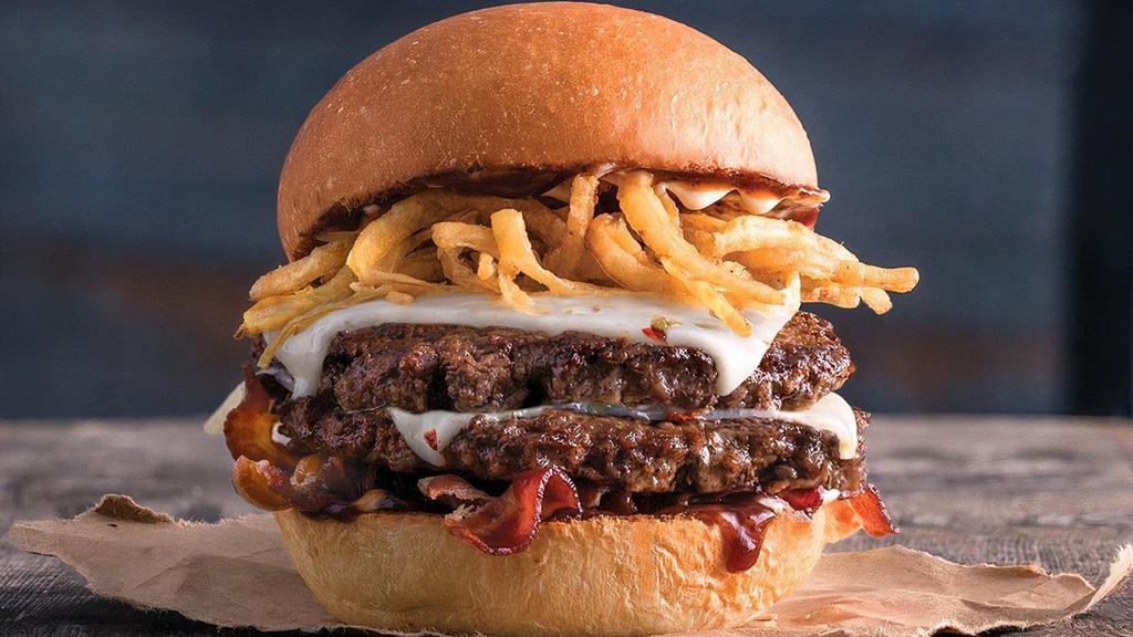 The Indulgent Bbq · Half pound of fresh, never-frozen Certified Angus Beef®, Pepper Jack Cheese, Applewood Smoked Bacon, Fried Onion Strings, Mayo, BBQ, Potato Bun