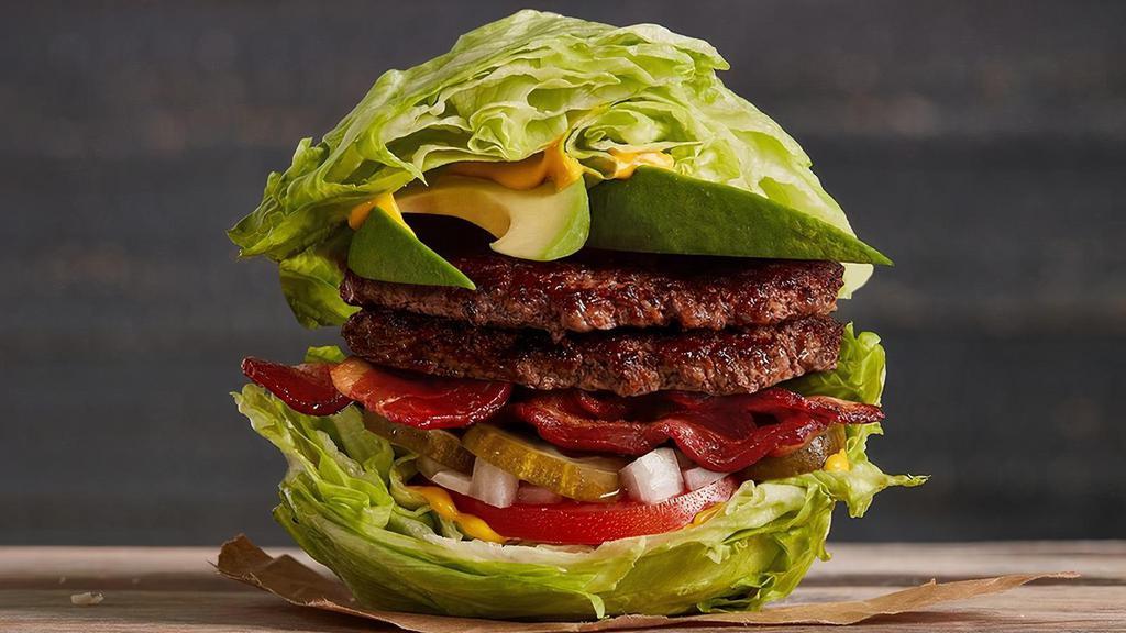 The Paleo · Half pound of fresh, never-frozen Certified Angus Beef® Iceburger, Applewood Smoked Bacon, Fresh Avocado, Pickles, Diced Onions, Tomato, Mustard