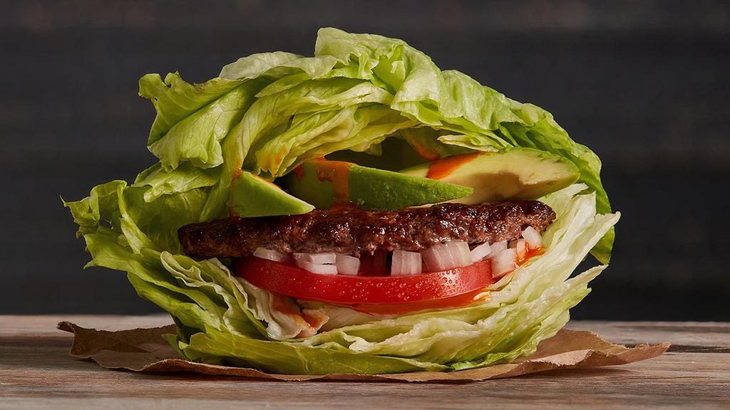 The Low Cal · Quarter pound of fresh, never-frozen Certified Angus Beef® Iceburger, Fresh Avocado, Diced Onions, Tomato, Cholula®