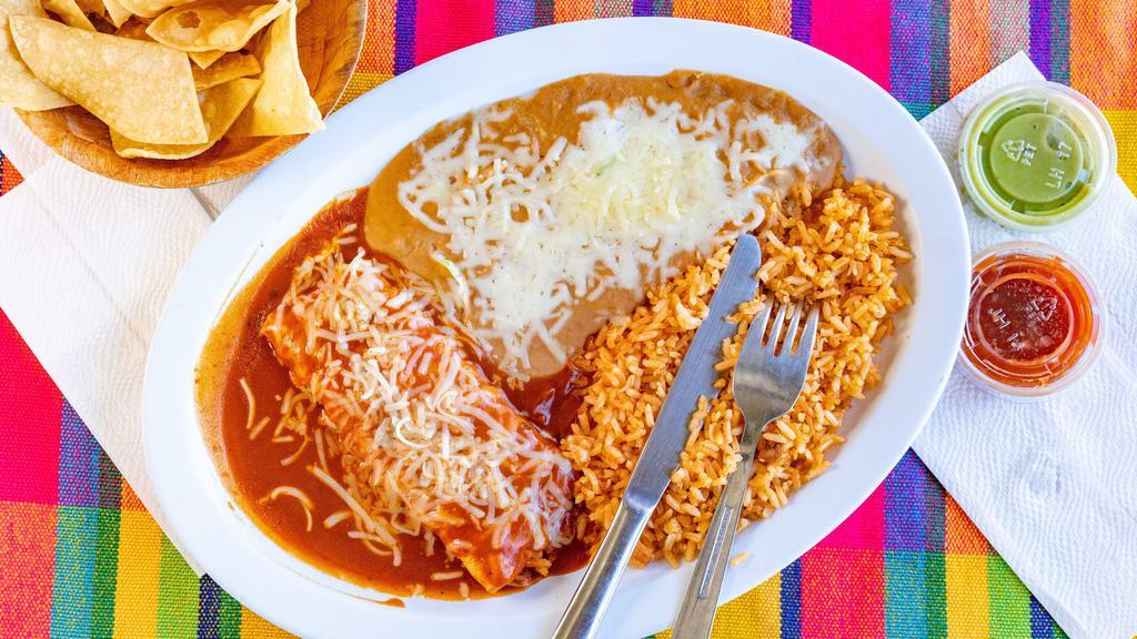 Enchiladas Marinas Plate · Flour tortilla rolled with shrimp, topped with red sauce and melted cheese. Served with refried beans and rice.