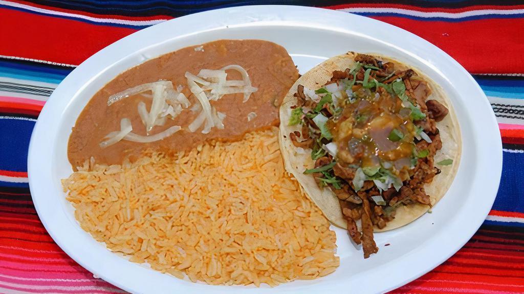 Taco Plate · Includes one taco, choice of meat, rice, refried beans, and cheese.
