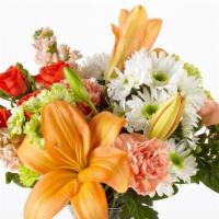 Debi Lily Perfect Gift Bouquet Arrangement · Beautiful Seasonal Bouquet arranged in a clear glass vase- Designers Choice