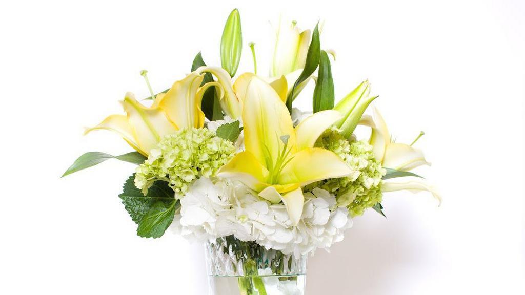 Seasonal Mixed Vased Arrangement · A beautiful assortment of our finest seasonal blooms arranged in a clear glass vase- Designers Choice