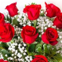 Dozen Red Rose Arrangement - Premium Vase · 12 Long stem RED roses beautifully arranged with foliage and a dainty filler flower in a kee...