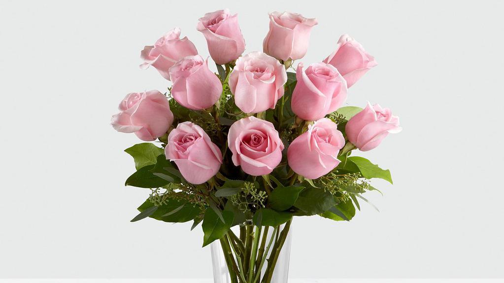 Dozen Pink Rose Arrangement · 12 Long stem PINK roses beautifully arranged with foliage in a clear glass vase