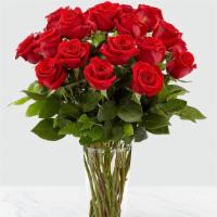 18 Red Roses Vased · 18 Long stem roses beautifully arranged with foliage in a clear glass vase
