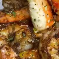 Seafood bake potato · Seafood bake potato- garnished with shrimps 
crab legs an amazing seafood sauce-