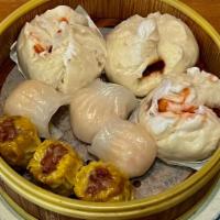 A4. Dim Sum Combo Plate · Three siu moi, three shrimp dumpling, 3 BBQ Pork bun.