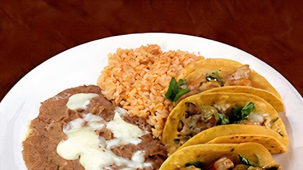 Taco Plate · 3 tacos with cilantro onions and green salsa choice of meat: steak, chicken, spicy pork, carnitas, chorizo, head, or tongue.