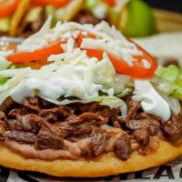 Sopes · beans, lettuce, guacamole, tomato, sour cream, cotija cheese, choice of meat: steak, chicken...