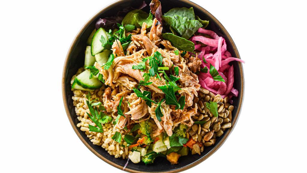 Chicken Mixed Bowl · base of greens & grains + juicy slow roasted chicken, cauliflower, broccoli, carrots, roasted sunflower seeds, pickled red onions, fresh cucumber, parsley garnish, & signature sauce// gluten, soy, dairy free // zero refined sugar