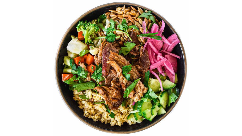 Pork Shoulder Hearty Bowl · base of millet & rice + tender slow roasted pork shoulder, cauliflower, broccoli, carrots, roasted sunflower seeds, pickled red onions, fresh cucumber, parsley garnish, & signature sauce // gluten, soy, dairy free // zero refined sugar