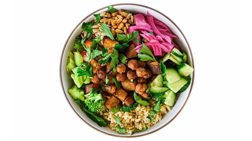 Chickpea & Potato Hearty Bowl · base of millet & rice + slow roasted organic chickpeas & potatoes, cauliflower, broccoli, carrots, roasted sunflower seeds, pickled red onions, fresh cucumber, parsley garnish, & signature sauce // gluten, soy, dairy free // 100% plant based