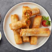 Thai Egg Rolls · Deep fried Thai egg rolls stuffed with chicken, silver noodles, and vegetables. Served with ...