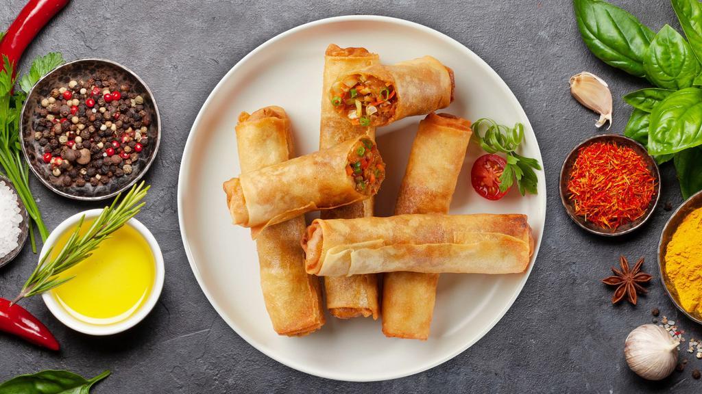 Thai Egg Rolls · Deep fried Thai egg rolls stuffed with chicken, silver noodles, and vegetables. Served with homemade sweet and sour sauce.