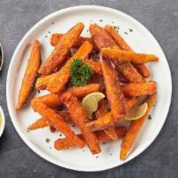 Fried Sweet Potatoes · Deep fried pieces of sweet potato. Served with homemade sauce and ground peanuts.