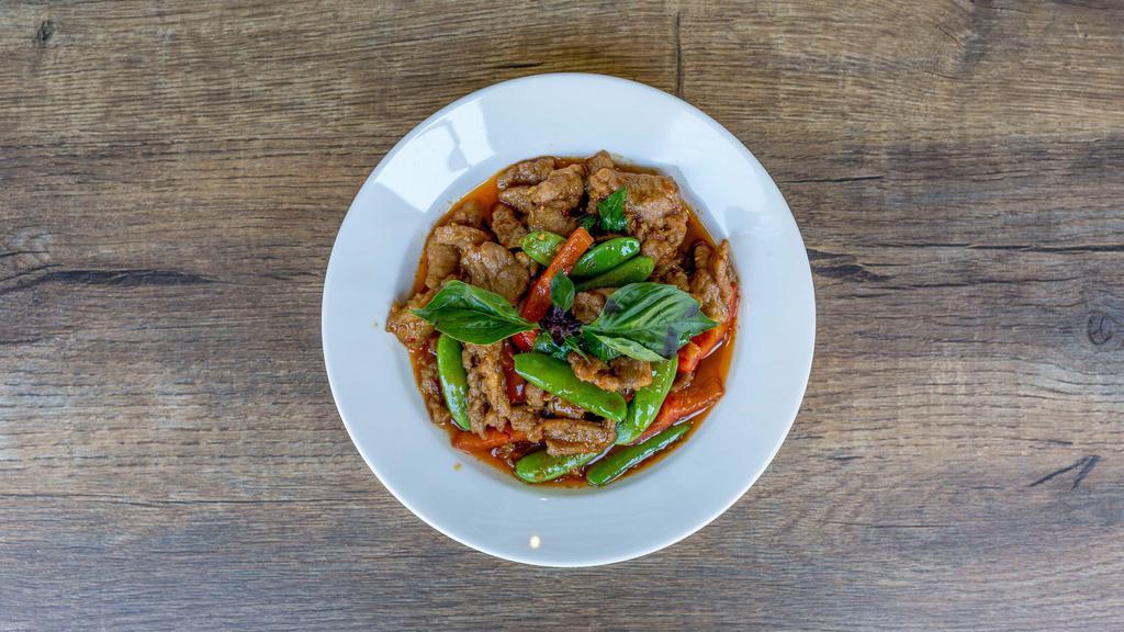 Lemongrass Pork · Gluten free available. Slices of Pork with chili, garlic, soy sauce, snap peas, red bell pepper, lemongrass and basil.