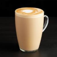 Caffe Latte · This coffee house favorite adds silky steamed milk to shots of rich espresso, finished with ...