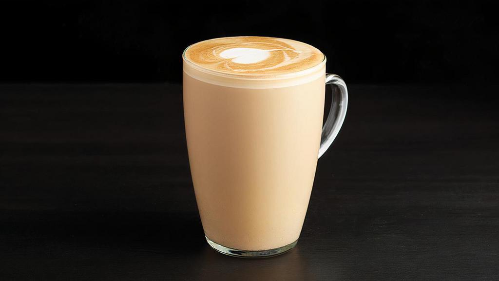 Caffe Latte · This coffee house favorite adds silky steamed milk to shots of rich espresso, finished with a layer of foam.