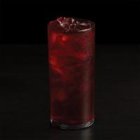 Iced Herbal Tea · A vibrant and sweet herbal infusion of tart hibiscus blended with a lush mix of elderberries...