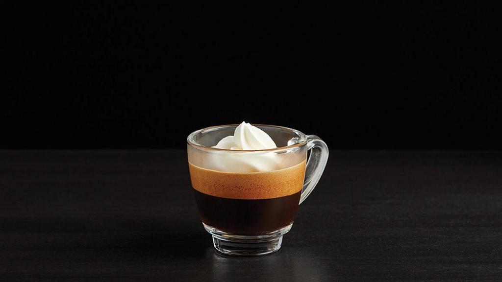Caffe Con Panna · Some days call for a little indulgence. This rich espresso shot topped with lush whipped cream does the trick.