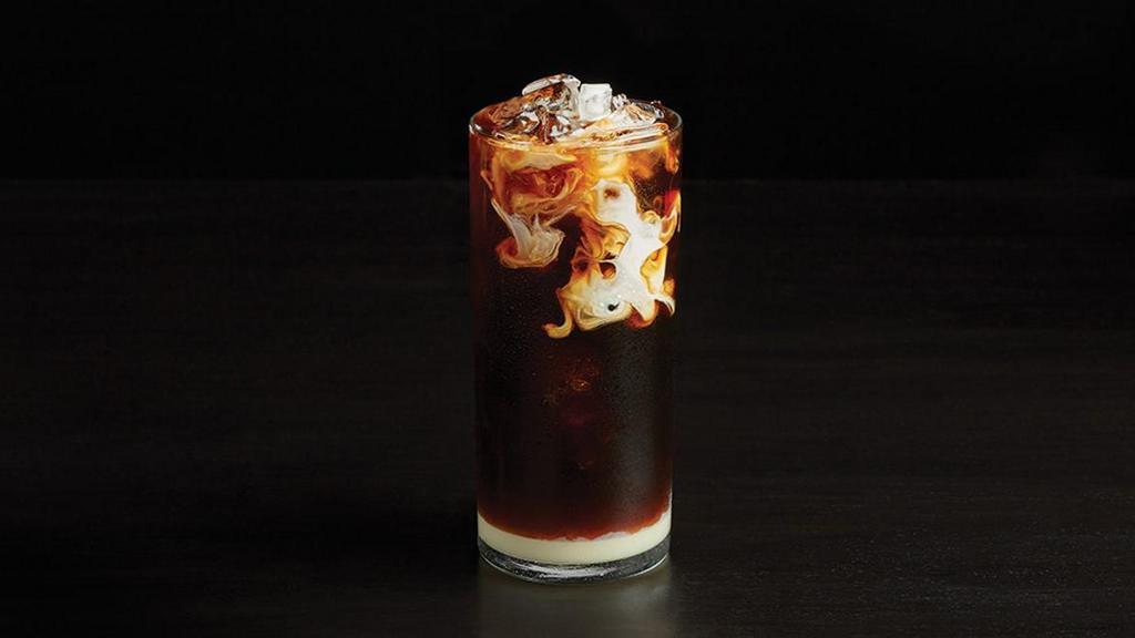 The Black Tie · Layered sweetened condensed milk, Cold Brew iced coffee, chicory infused simple syrup, and a float of half and half.