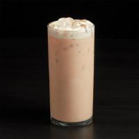 Iced Chai Latte · Sweet, spicy Masala Chai Tea is poured over ice with fresh chilled foam and milk.