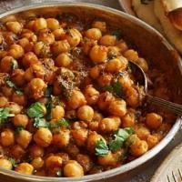 Chana Masala (16 Oz) · Chickpeas cooked with onion, tomato, herbs and spices.