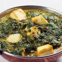 Saag Paneer (16 Oz) · Fresh mustard cooked with herbs spices and homemade cheese cube.
